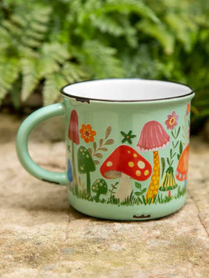 Ceramic mug green with colorful mushrooms. Coffee or tea.