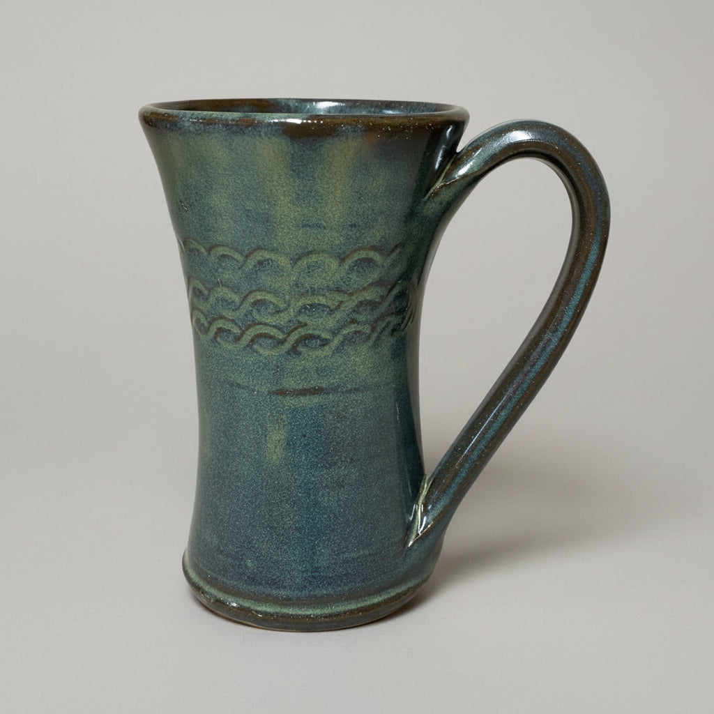 Coffee mug 12 ounces handmade with scroll design. Pottery tea cup