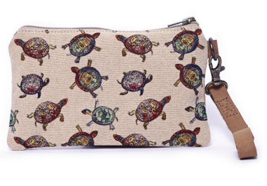 Zipper wristlet  with turtles. Lined and real leather strap. Cotton canvas artwork on wallet.