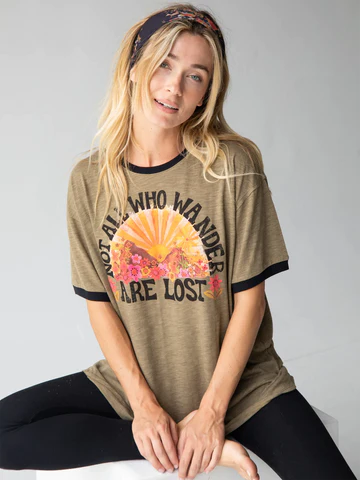Natural Life brand tee shirt reads. Not all who wander are lost.
