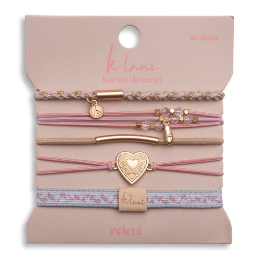 Set of hair ties and accessories on a branded card with 'klari' branding.