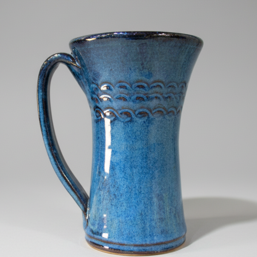 Coffee mug 12 ounces handmade with scroll design. Pottery tea cup