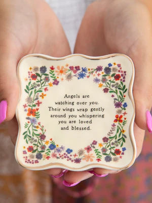 Angels watching you and wings wrapped around you. Ceramic dish with flowers.