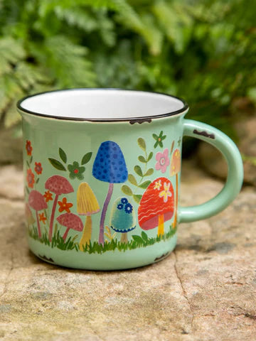 Ceramic mug green with colorful mushrooms.  Coffee or tea.