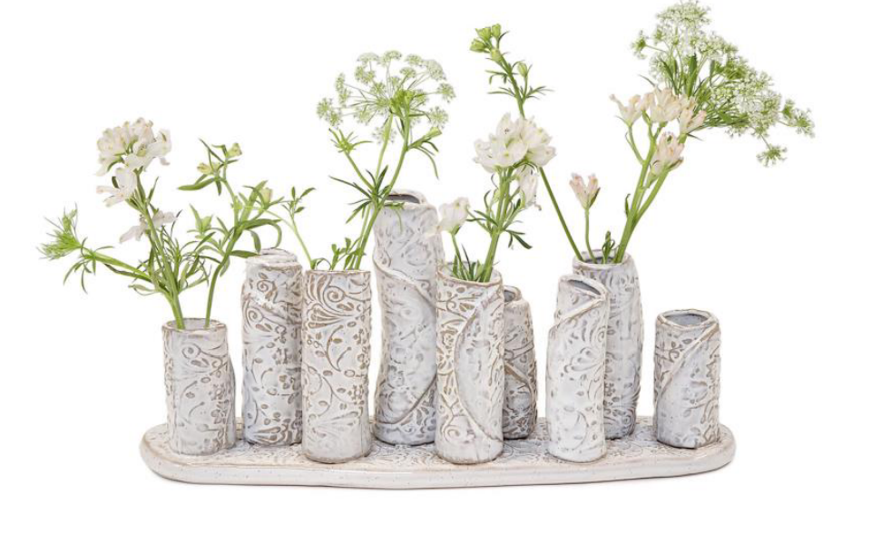 White washed embossed pattern multi vase with 9 sections on platform