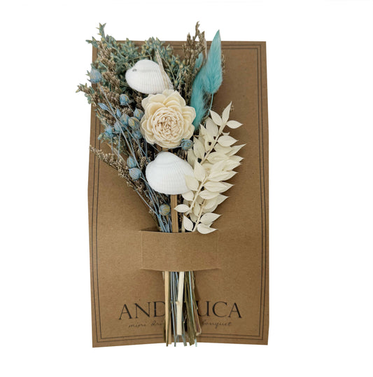 Bouquet of dried flowers in a brown box with 'ANDREA' branding on a white background