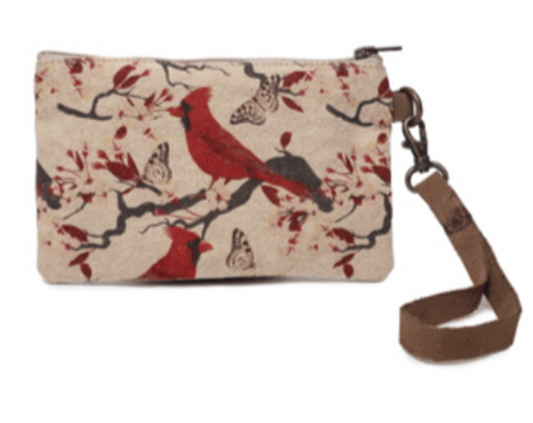 Canvas wristlet with red birds. Lined on inside and real leather handle. Cotton canvas artwork of cardinal