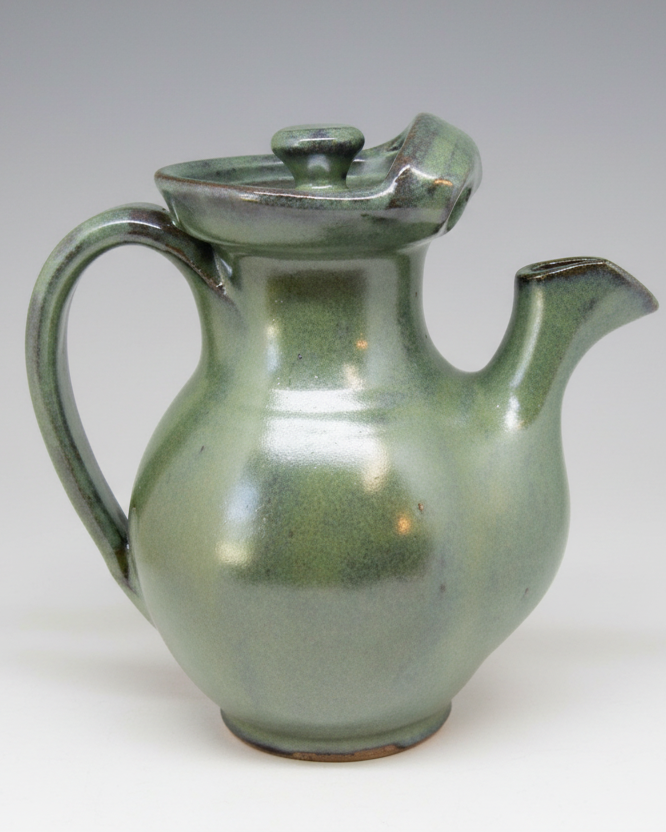 handmade teapot with pour spout for steeping and serving tea coffee milk creamer
