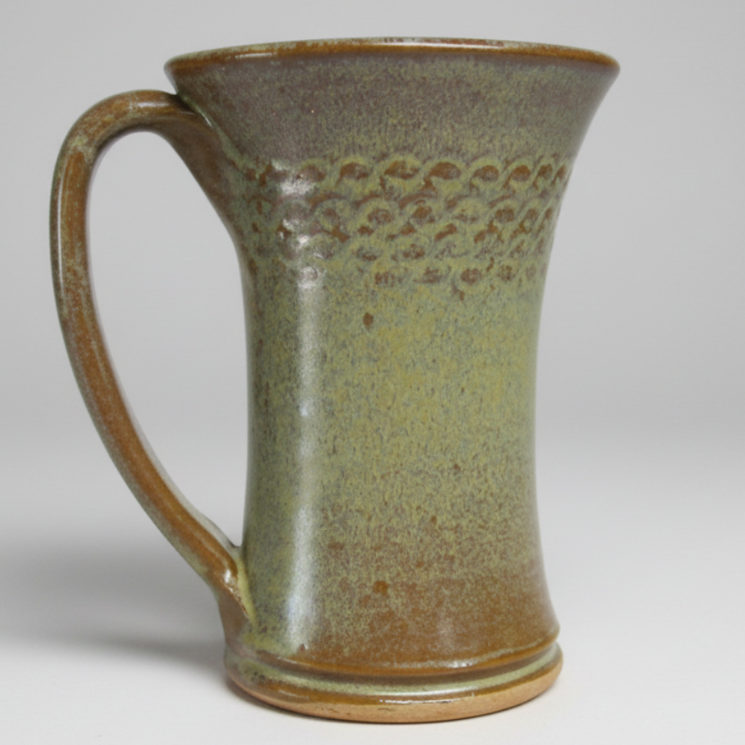 Coffee mug 12 ounces handmade with scroll design. Pottery tea cup